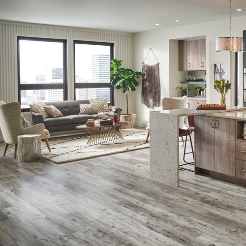 Open space living room with brown laminate floor from Flooring Xpress Enterprise and Design in Chicago, IL