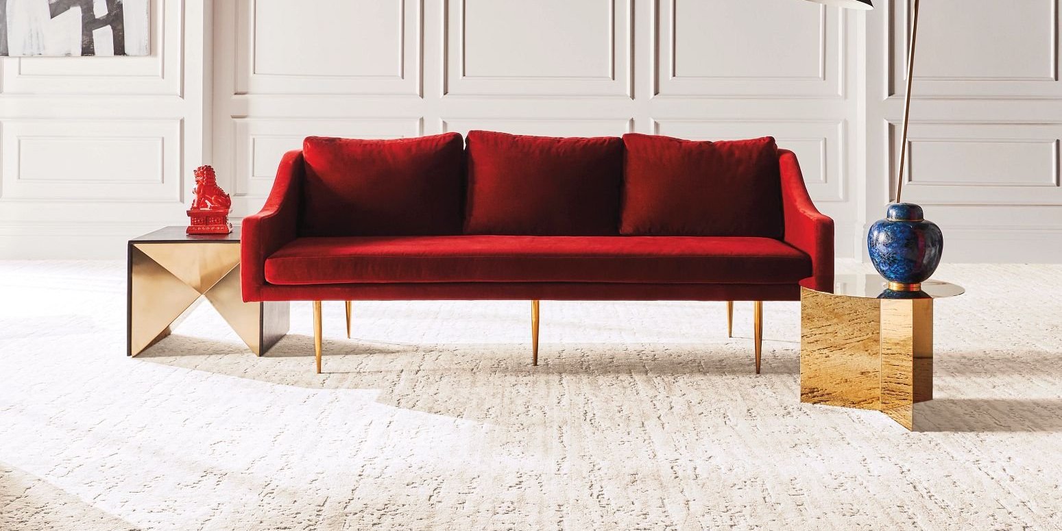 Red sofa on beige carpet from Flooring Xpress Enterprise and Design in Chicago, IL