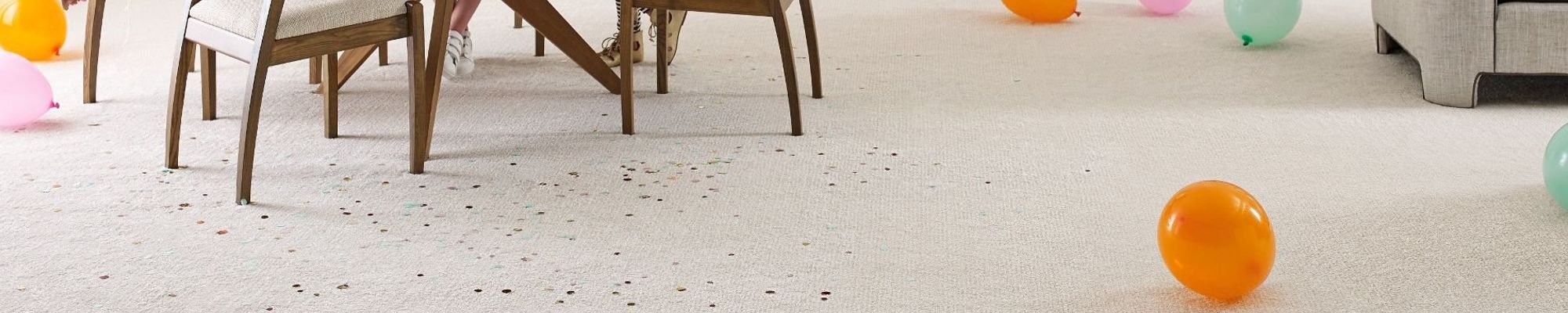 Living room with balloons on cream carpet from Flooring Xpress Enterprise in Chicago